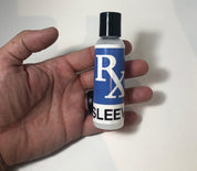 Hand holding penis sleeve lube